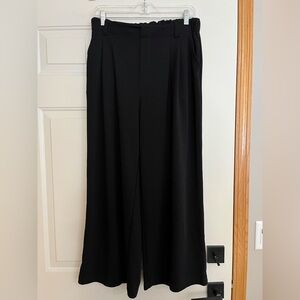 Women’s Halara black flex daystretch high waisted flare pants. Size petite large